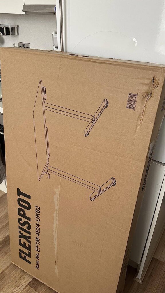 view of our own purchase testing flexispot fq1m standing desk with built in cable management our unboxing package arrival several weeks to months